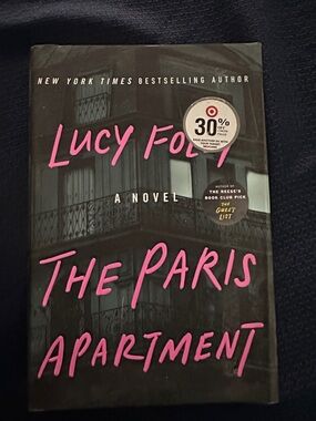 The Paris Apartment by Lucy Foley - Black Cover with Pink Title
